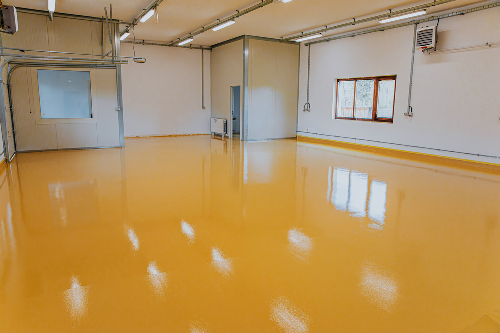 New epoxy floor in warehouse factory. Construction series